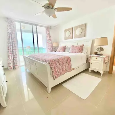 a white bedroom with a bed and a window at 3 Bedrooms At Marbella Beachfront Juan Dolio no820 in Juan Dolio