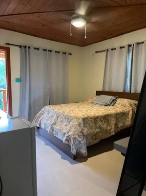 a bedroom with a bed in a room at Villa Zarina - Polo Barahona in Polo