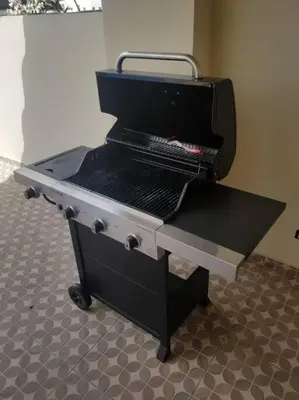 a grill sitting in a room with a floor at Escape Penthouse near Blue Mall - 4BR with Private Rooftop & City Views in Santo Domingo