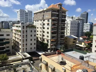 an aerial view of a city with tall buildings at Escape Penthouse near Blue Mall - 4BR with Private Rooftop & City Views in Santo Domingo