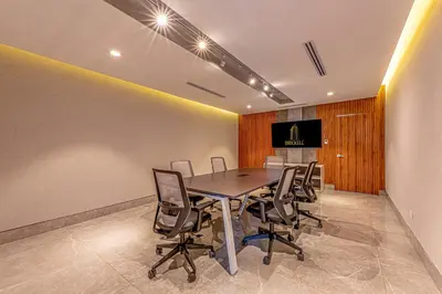 a conference room with a table and chairs at Brickell Apart Hotel in Santo Domingo