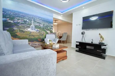 a living room with a large flat screen tv at The apartment you dreamed of 1 in Santiago de los Caballeros