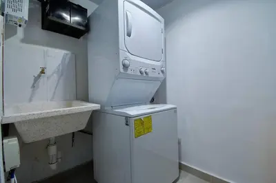 a small bathroom with a sink and a small refrigerator at The apartment you dreamed of 1 in Santiago de los Caballeros