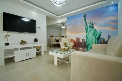 a living room with the statue of liberty on the wall at The apartment you dreamed of 2 ! in Santiago de los Caballeros