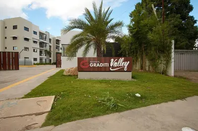 a sign for a apartment building with a palm tree at The apartment you dreamed of 2 ! in Santiago de los Caballeros