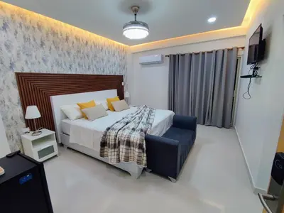 a bedroom with a bed and a television in it at Hotel el barco in Azua de Compostela