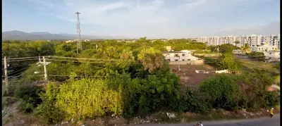 an overhead view of a city with trees and buildings at 2 Bedrooms at Baia Residences in Santiago de los Caballeros