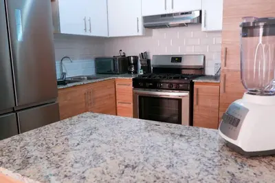 a kitchen with a blender on top of a counter at 2 Bedrooms at Baia Residences in Santiago de los Caballeros