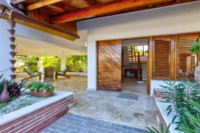 an open door of a house with a patio at Río Mar Cumayasa in La Romana
