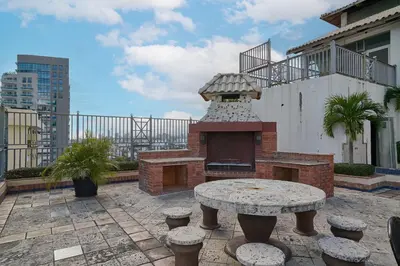 a patio with a table and a brick oven at Gateway For You And Your Loves Ones I Sleeps 6 in Santo Domingo