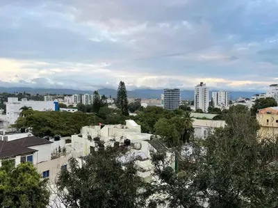 a view of a city with buildings and trees at Paradise Room Rialto Residences in Santiago de los Caballeros