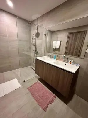 a bathroom with a sink and a shower at LUXURY CONDO Cana Bay 1 CLUB BEACH in Punta Cana