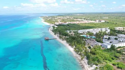an aerial view of the beach in front of a resort at Caribbean Star - Estrella Dominicus Bayahibe in Bayahibe