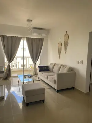 a living room with a couch and a table at Bridget Place in Bayahibe