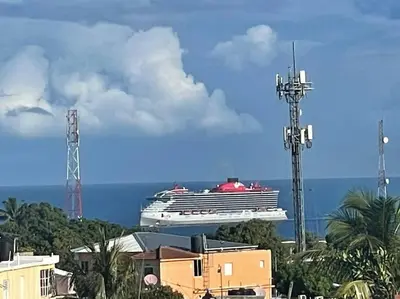 a cruise ship in the ocean with a building at Royal Terrace IV (King) in San Felipe de Puerto Plata